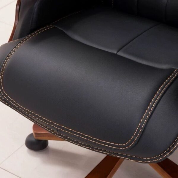 Upgrade your workspace with our premium executive office chair, meticulously crafted for professionals who demand both luxury and functionality. Designed with a commanding presence, this chair features plush black leather upholstery, complemented by intricate diamond-pattern stitching that adds a refined aesthetic. The solid wood armrests and sturdy wooden base enhance durability and sophistication, while the smooth-rolling casters ensure effortless mobility. With an ergonomic design tailored for extended use, this chair provides adjustable comfort settings, supporting proper posture and reducing fatigue. Whether in a corporate office or an elegant home workspace, it delivers a perfect blend of style, support, and durability to redefine your seating experience.